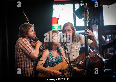 The American folk band The Stray Birds performs a live concert at the Danish folk, blues and country music festival Tønder Festival 2014. The band consists of the singers and musciains Maya de Vitry, Oliver Craven and Charlie Muench. Denmark, 28/08 2014. EXCLUDING DENMARK. Stock Photo