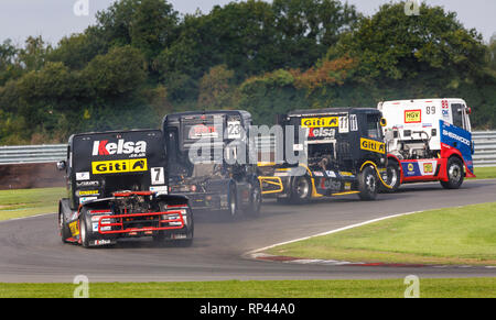 Simon Reid, Martin Gibson, Jamie Anderson and Stuart Oliver head through Oggies at the Snetterton 2018 Division 1 Truck Racing event, Norfolk, UK. Stock Photo