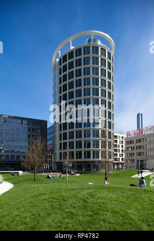 Office building 'Coffee Plaza' in the HafenCity, Hamburg with people relaxing in the park Stock Photo