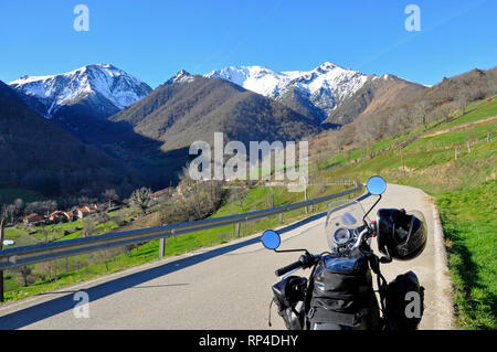 Motorcycling through the  Picos de Europa in Cantabria, Spain on a Royal Enfield Himalayan 411cc motorbike. Stock Photo