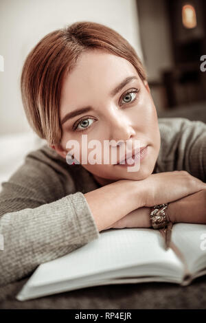 Blue-eyed blonde woman wearing stylish bracelet feeling excited Stock Photo