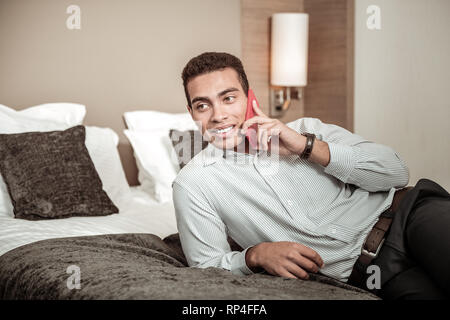 Businessman calling his wife after successful flight and trip Stock Photo