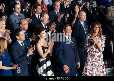 U.S First Lady Melania Trump, right, applauds Florida Governor Ron DeSantis, 2nd right, as he is introduced during an address to the Venezuelan American community by President Donald Trump delivers February 18, 2019 in Miami, Florida. Standing in the front row left to right are: Jeanette Rubio; Senator Marco Rubio; Casey DeSantis. Second row guests include Hilary Geary, wife of Secretary Ross; Secretary of Commerce Wilbur Ross; and U.S. Trade Representative Ambassador Robert Lighthizer. Stock Photo