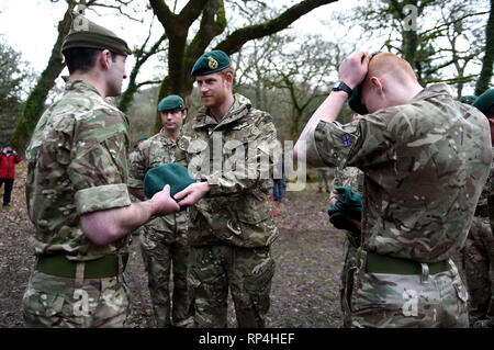 The Duke of Sussex carries out a Green Beret presentation during a visit to 42 Commando Royal Marines at their base in Bickleigh. Stock Photo