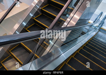 Escalators in shopping mall Stock Photo