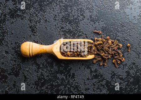 Carnation, dried clove spice in scoop. Stock Photo