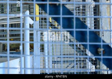 Industrial stairway. Close-up. Industrial iron staircase. Background. Macro image can be used as background. Stock Photo