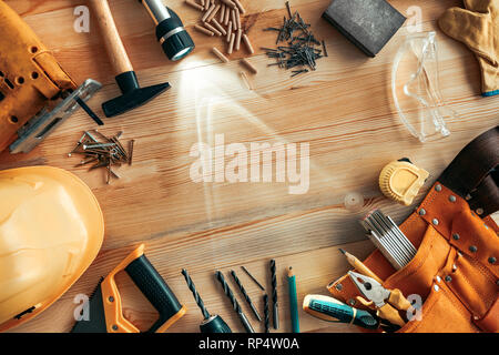 Carpenter woodwork workshop desk top view mock up with various tools around blank copy space of pine wood material Stock Photo