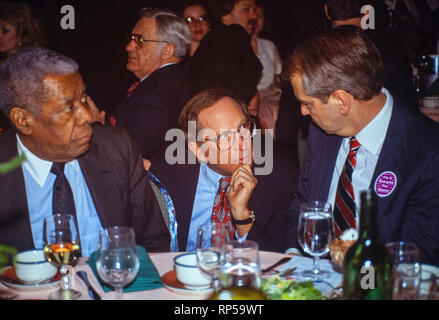 U.S. Senator Sam Nunn a democrat from Georgia talks with Senator Paul Tsongas (right) and Atlanta businessman and insurance executive Jesse Hill (left) at a Georgia Democratic Party dinner Stock Photo