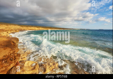 Storming sea and wide-spreading waves, Cyprus coastline. Stock Photo