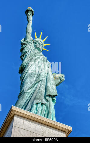 Replica of the Liberty Statue against the sunset in Paris Stock Photo