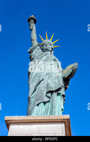 Replica of the Liberty Statue against the sunset in Paris Stock Photo