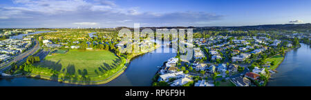 Wide aerial panorama of Reedy creek and luxury houses. Varsity Lakes, Gold Coast, Queensland, Australia Stock Photo