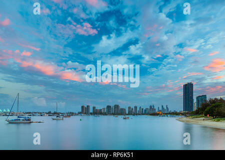 Beautiful sunset sky over moored boats and luxury real estate. Gold Coast, Queensland, Australia Stock Photo