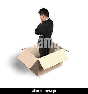Man thinking in the opened box, isolated on white background. Stock Photo