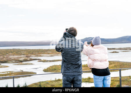 Thingvellir, Iceland - September 20, 2018: National Park during cold autumn day in Iceland Golden circle and people taking pictures of landscape Stock Photo