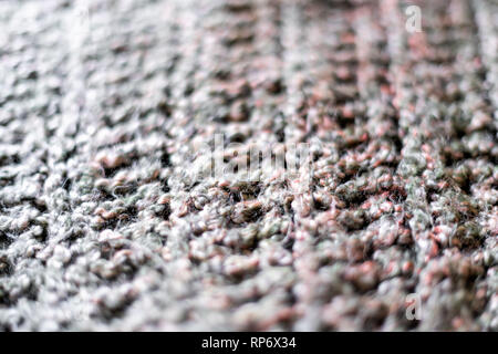 Macro abstract closeup texture of yarn knitted sweater or scarf handmade with pink and grey colors background Stock Photo