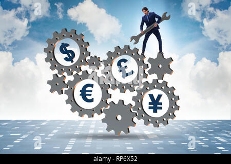 Businessman in multiple currencies concept Stock Photo
