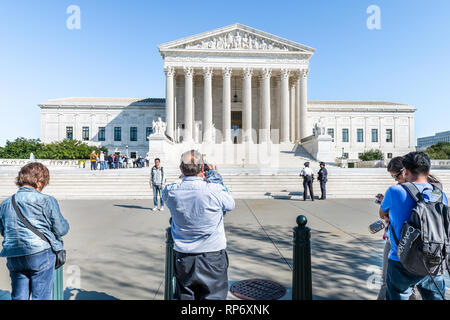 Washington DC, USA - October 12, 2018: People tourists taking pictures by steps of Supreme Court marble building architecture on Capital capitol hill  Stock Photo