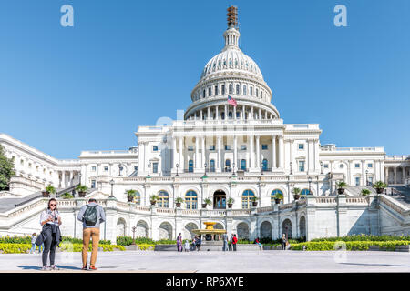 Washington DC, USA - October 12, 2018: Congress dome construction exterior with steps stairs view and people on Capital capitol hill with blue sky col Stock Photo