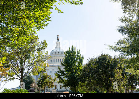 US Congress dome closeup with sky in Washington DC, USA on Capital capitol hill and construction workers painting exterior on scaffold scaffolding sta Stock Photo