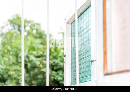 Abstract closeup of bars in open window during summer in country house for anti-theft Stock Photo