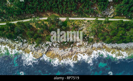 Drone aerial view of road on sea coastal in Galicia, Spain. Stock Photo