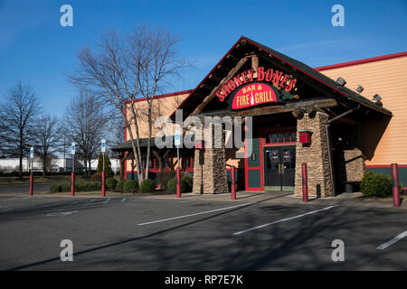 A logo sign outside of a Smokey Bones Bar and Fire Grill restaurant location in Fredericksburg, Virginia on February 19, 2019. Stock Photo