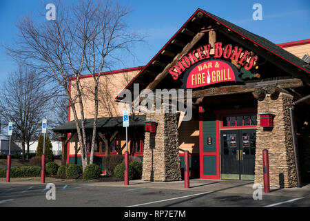 A logo sign outside of a Smokey Bones Bar and Fire Grill restaurant location in Fredericksburg, Virginia on February 19, 2019. Stock Photo