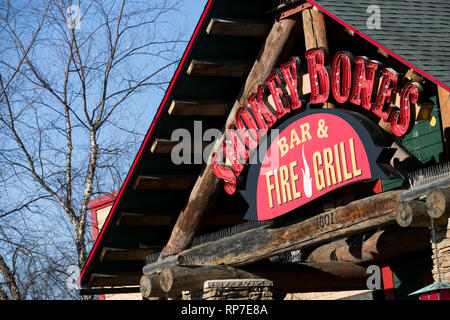 A logo sign outside of a Smokey Bones Bar and Fire Grill restaurant location in Fredericksburg, Virginia on February 19, 2019. Stock Photo