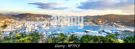 Business concept, modern cityscape of nagasaki dusk from mount inasa, the new top 3 nightview of the world, aerial view, copy space Stock Photo