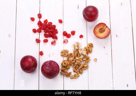 Ingredients for muesli on a white wooden background Stock Photo