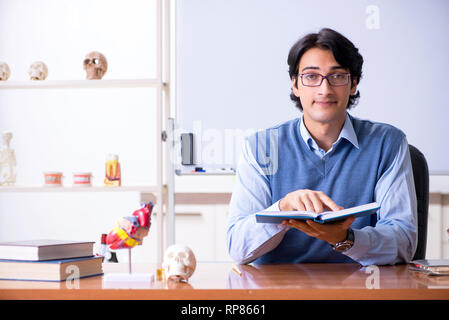 Young lecturer teacher teaching anatomy Stock Photo