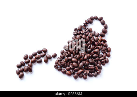 Roasted coffee beans scattered into a shape of a cup pouring or spilling coffee. Isolated on white background. Stock Photo
