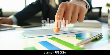 Hand of businessman in suit filling and signing with Stock Photo