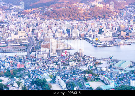 Business concept, modern cityscape of nagasaki dusk from mount inasa, the new top 3 nightview of the world, aerial view, copy space Stock Photo