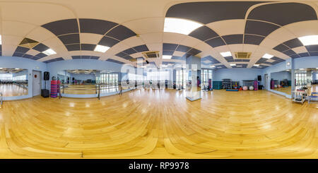 360 degree panoramic view of MINSK, BELARUS - JULY, 2017: full seamless panorama 360 angle view in interior of stylish fitness club gymnastics room and callanetics with sports sim