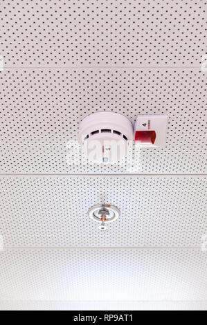 Israel, Arava - 04 December 2018: Smoke detector and sprinkler installed in dropped ceiling, Arava, Israel Stock Photo