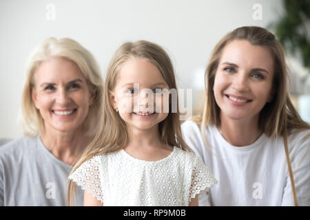 Head shot portrait grandmother, mother and daughter, three generations Stock Photo