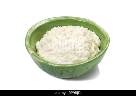 Rice porridge for breakfast in a green bowl. Stock Photo