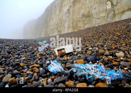 Plastic washed up on a pebble beach, Newhaven, East Sussex. Stock Photo