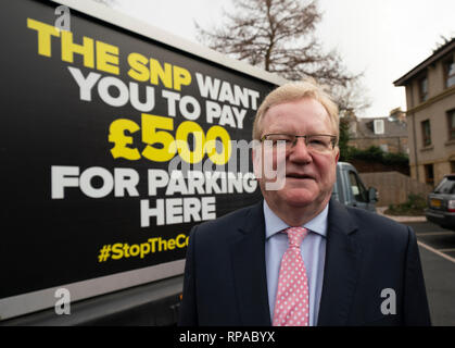 Edinburgh, Scotland, UK. 21st Feb, 2019. Jackson Carlaw MSP and Miles Briggs MSP unveil an Ad Van at an Edinburgh care home today before it travels across the central belt of Scotland to workplaces that are set to be hit by the proposed Car Park Tax which is to be voted through the Scottish Parliament by the SNP and Green parties. Jackson Carlaw MSP Credit: Iain Masterton/Alamy Live News Stock Photo
