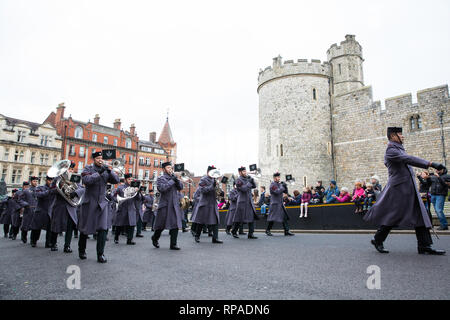 Windsor, UK. 21st February, 2019. The Band of the Brigade of Gurkhas leads 36 Engineer Regiment Queen's Gurkha Engineers in the Changing of the Guard ceremony at Windsor Castle. The Queen's Gurkha Engineers will provide the Windsor Guard until April 12th, for the first time since the celebrations marking 200 years of service to the Crown in 2015. Credit: Mark Kerrison/Alamy Live News Stock Photo