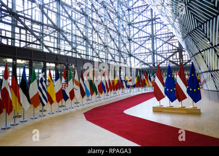Brussels, Belgium. 21st February 2019. Flags of Latvia and EU flags stand in the European Council . Alexandros Michailidis/Alamy Live News Stock Photo
