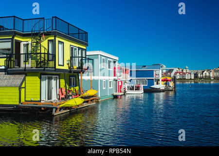 Floating Home Village colorful Houseboats Water Taxi Fisherman's Wharf Reflection Inner Harbor, Victoria British Columbia Canada Pacific Northwest. Ar Stock Photo