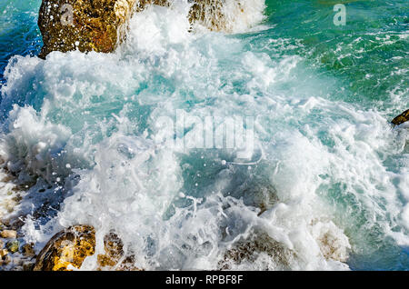 Waves beat on the coastal stones. Stock Photo