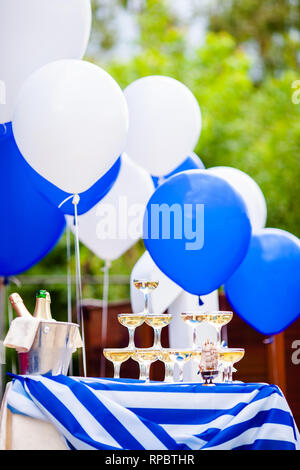 Champagne glasses standing in a tower at the party. Stock Photo