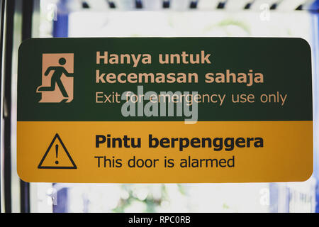 Emergency Exit And Door Alarm Sign Written Ni Malay And English Language Image Stock Photo Alamy