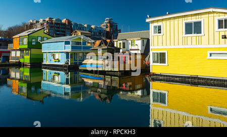 The colorful village of float homes on a bright sunny day, blue sky. Stock Photo