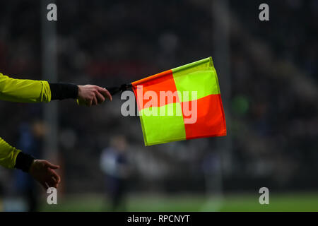 Thessaloniki, Greece - February 19, 2019: The assistant referee holds his flag out for an offside during the match UEFA Youth League for second round  Stock Photo